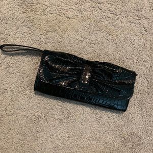 Leather, black clutch. Used one time.